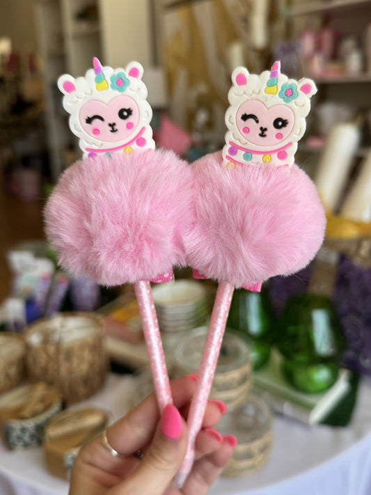 Pink unicorn llama puff pen with fluffy pom-pom and glittery barrel held in hand